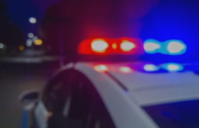 police car with flashing lights. Here's what to do when you approach one