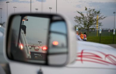 Emergency,Lights,Seen,In,Side,Mirror,Of,Vehicle