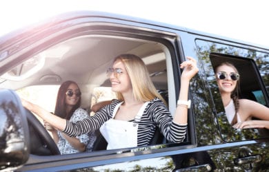 Happy,Friends,Together,In,Car,On,Road,Trip